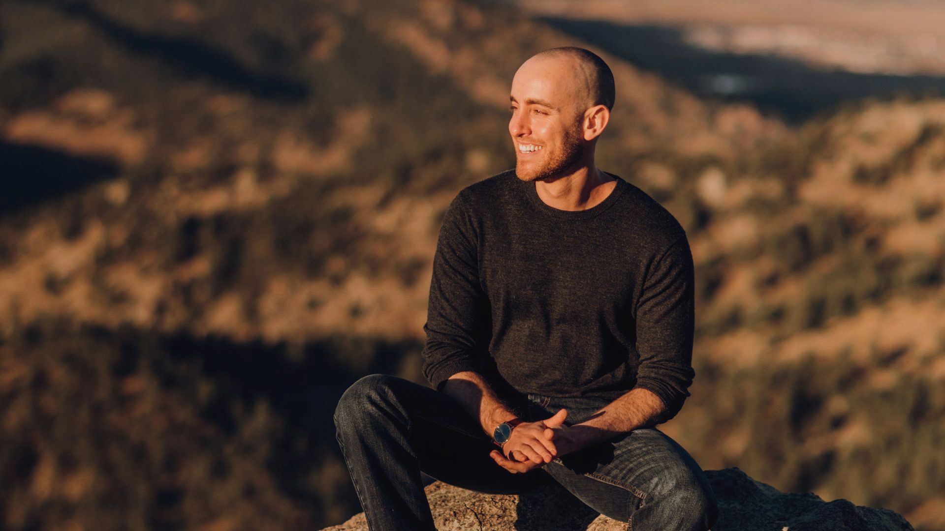 Jason Moss in the mountains at golden hour